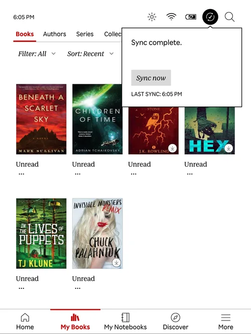 Kobo after removal showing one fewer book, with Sync complete dialog